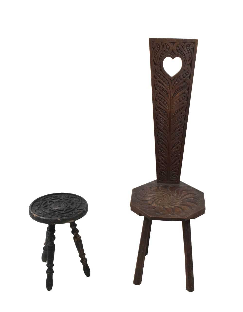 Spinning chair with carved decoration together with a similar stool