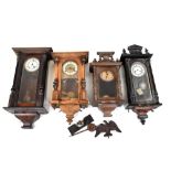 Four Vienna wall clocks