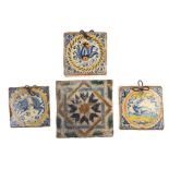 Three 17th Century Dutch Delft tiles, together with a Spanish tile