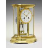 Late 19th Century French lacquered brass oval four-glass mantel clock - Vincenti