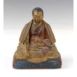 Chinese or Tibetan carved wooden figure of a seated Buddhist monk