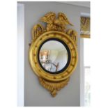 Regency style giltwood convex wall mirror