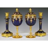 Pair of 19th Century French covered cups and similar candlesticks