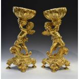 Pair of gilt metal centrepieces of winged cherubs