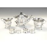 Edwardian VII silver three-piece tea set and three silver napkin rings