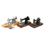 Three vintage cased sewing machines