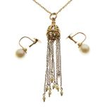 Unmarked yellow metal and seed pearl pendant. a 9ct gold chain and a pair of cultured pearl earrings