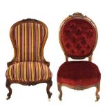 Two Victorian walnut showframe upholstered salon chairs