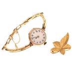 9ct gold leaf design brooch, together with a 9ct gold cased cocktail watch