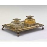 George V silver shaped rectangular desk stand having two glass inkwells
