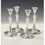 Set of four Edwardian silver Adams style candlesticks of oval form