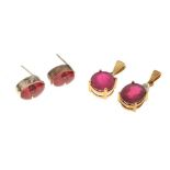 Two similar pendants set rubies and white stones, and a pair of white metal stud earrings