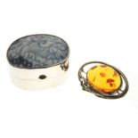 Amber brooch, trinket box, and two loose sapphires
