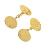 Pair of 18ct gold cufflinks, engraved with hand symbol