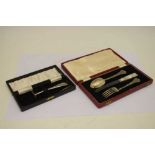 Cased Elizabeth II silver three piece Christening set and a cased George V silver pusher