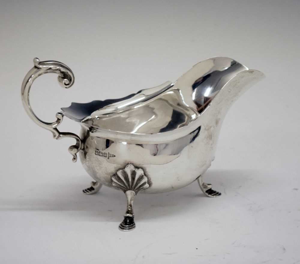 Edward VII silver sauce boat with flying scroll handle