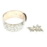 Edward VIII engraved silver bangle together with a silver brooch depicting two ballerinas