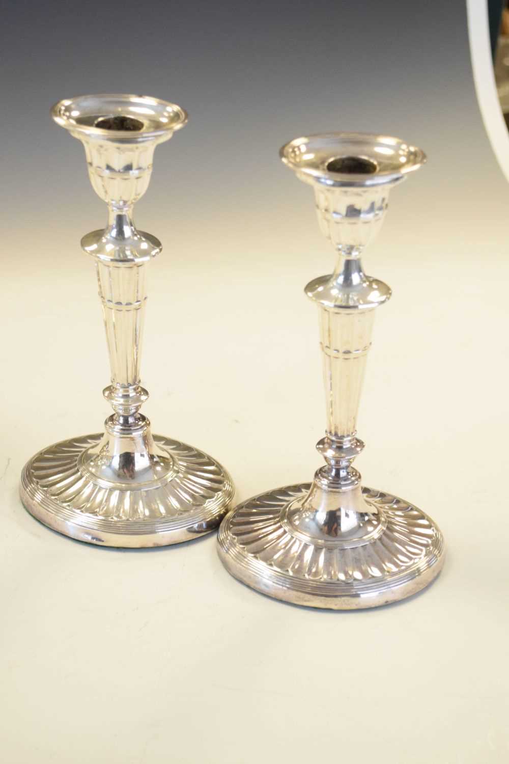 Set of four Edwardian silver Adams style candlesticks of oval form - Image 4 of 6