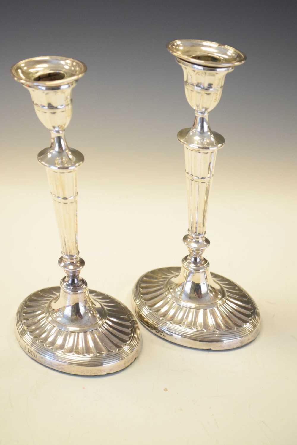 Set of four Edwardian silver Adams style candlesticks of oval form - Image 5 of 6
