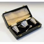 Cased George VI Art Deco style three-piece silver condiment set