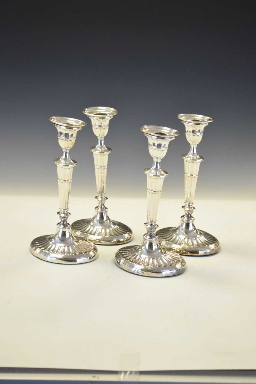 Set of four Edwardian silver Adams style candlesticks of oval form - Image 2 of 6