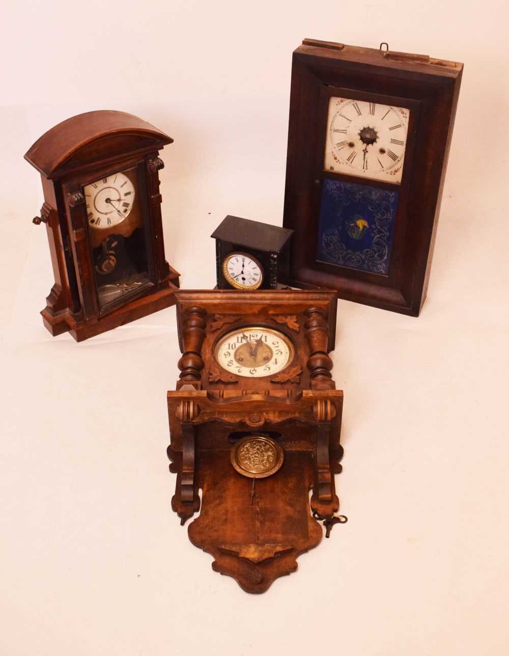 Four clocks to include; an American wall clock, slate mantel clock, etc