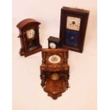 Four clocks to include; an American wall clock, slate mantel clock, etc