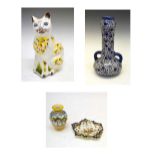 Quantity of faience to include money box cat, figural jug, etc