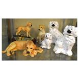 Three Beswick Staffordshire style spaniels, together with other Labrador figures
