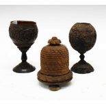 Two carved coconut cups together with a string box in the form of a beehive