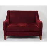 Modern two-seater low-back settee or sofa