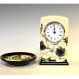 Moorcroft pottery mantel clock with floral decoration on a cream ground