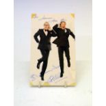Autographs - Morecambe and Wise multi-signed colour publicity photograph