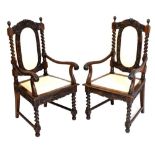 Pair of reproduction chairs with carved decoration and padded backs