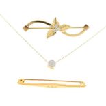 750 yellow metal and diamond bar brooch,, a 9ct brooch, and a 9ct pendant with chain