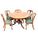 Five Victorian James Reilly of Manchester Patent dining chairs, plus a centre table