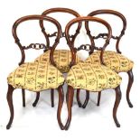 Four Victorian walnut balloon back chairs