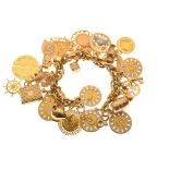 Yellow metal charm bracelet, stamped 750, 96.2g gross approx