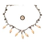 A Victorian cut steel necklace of cluster and festoon design