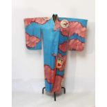 Japanese kimono or robe, with stylised flowers on pale coral ground