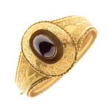 A Victorian garnet set gold hinged bangle