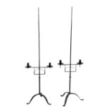 Manner of Ernest Gimson - Pair of early 20th Century wrought iron candle holders