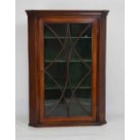 Early 19th century astragal glazed mahogany hanging corner cupboard