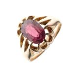 9ct gold ring, claw set an oval garnet-coloured stone