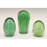 Three green glass 'dump' paperweights