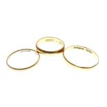 Three 22ct gold wedding bands