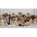 Quantity of approximately thirty modern bisque headed dolls