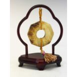 Chinese jade 'Bi' disc on hardwood stand