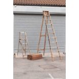 Two wooden step ladders, and a pine box