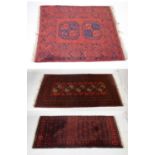 Three Middle Eastern red ground rugs